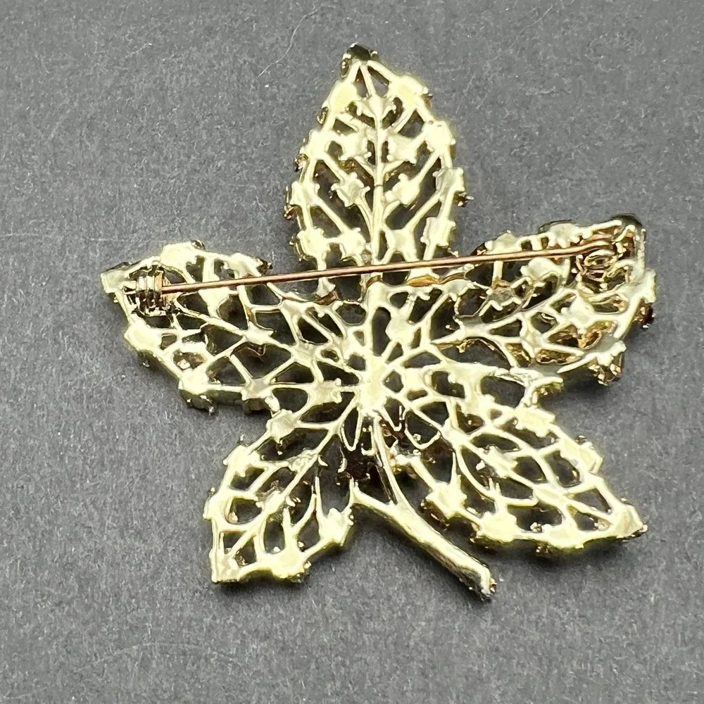 Gold Tone Leaf Brooch Red Rhinestone Accents Textured Openwork Vintage Style Pin